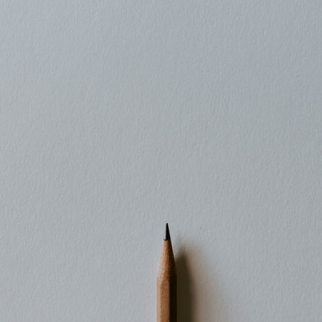 brown pencil on white surface